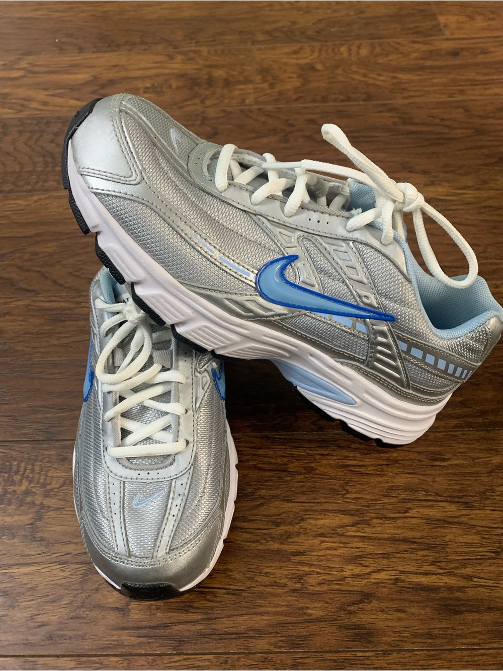 Nike Silver Athletic Sneakers with Blue Swoosh